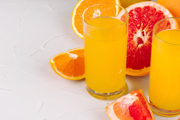Glass of orange juice and orange slices