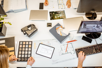 Creative workplace of designers or architects, designing interior. Top view on the table with...