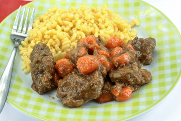 beef and carrot cooked in a dish
