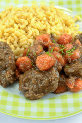 beef and carrot cooked in a dish
