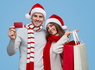 Obraz premium Happy couple during Christmas shopping
