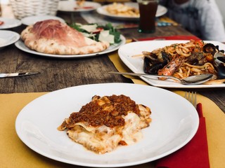 lasagna and spaghetti with seafood.  Italian food.