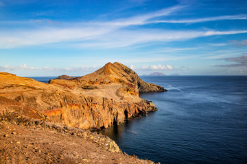 Fototapeta premium Sunset over Maderia island landscape, Ponta de sao Lourenco. It is nature background of a wonderful view of the sea cliffs, Portugal. It is a natural background.