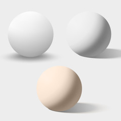 White and cream realistic spheres isolated on white