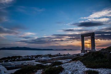 Portara - ruins of ancient temple of Delian Apollo on Naxos island at sunset, Cyclades archipelago, Greece.