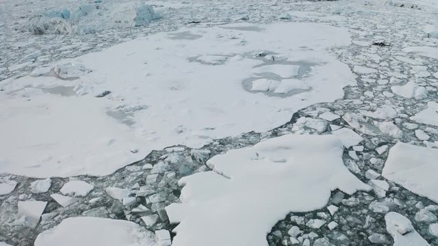 Aerial view of the J kuls rl n glacial lagoon and floating icebergs. The beginning of spring in Iceland