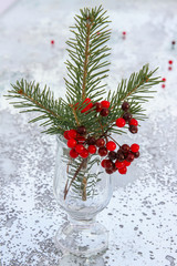 Christmas fir branch with red berries.selective focus 