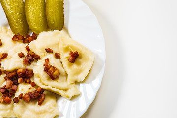 Dumplings with meat bacon scratchings.