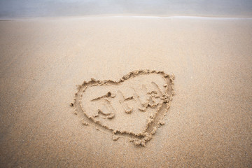 Heart drawn on the beach.