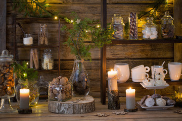 Obraz na płótnie Canvas Christmas decoration cocoa bar with cookies and sweets on old wooden background in natural rustic style. Winter cozy concept