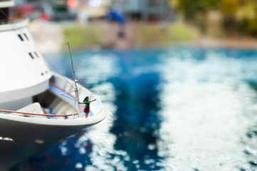 Obraz premium toy female figure stands on the bow of the ship