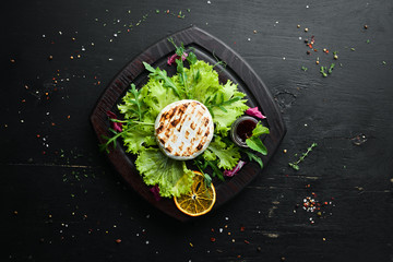Camembert cheese is grilled. Top view. Free copy space.