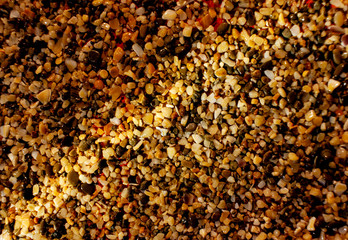 Background of gravel and small multi-colored river pebbles