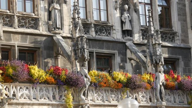 Munich, Germany - October 25, 2019: The new town hall in Munich is decorated with a variety of blooming flowers. Marienplatz, the central square of the city