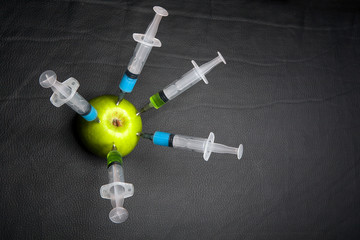 nitrate syringe apple leather background 