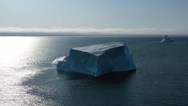 Tabular Iceberg Piece Antarctic Ocean Aerial View. Big Ice Formation Melt in Clear Water, Global Warming Concept Drone Flight. Polar Nature Glacier Wave Seascape. Footage Shot in 4K UHD