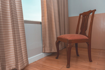 A chair near glass window