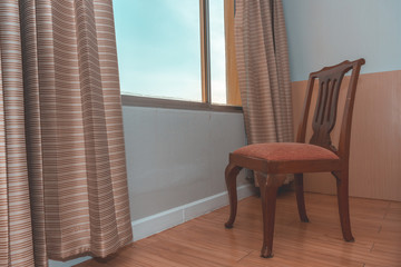 A chair near glass window