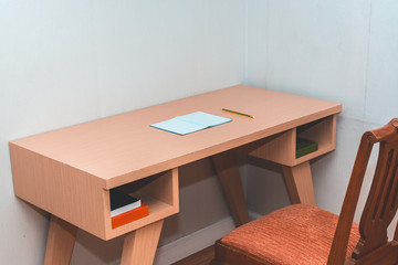 Desk with apencil and a notebook