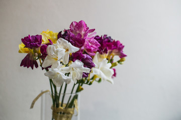 beautiful multi-colored alstroemeria bouquet in a glass vase