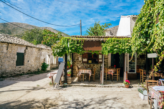 Main square with cafeterias and tavernas in abandoned village Old Perithia