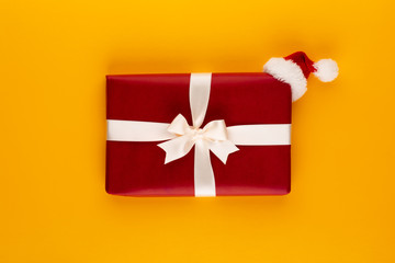 Christmas, holiday present box on red background.