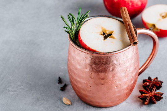 Apple Cider Moscow Mule Cocktail With Cinnamon Stick And Rosemary In Copper