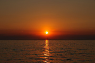 Fototapeta na wymiar Colorful orange sunset on the sea