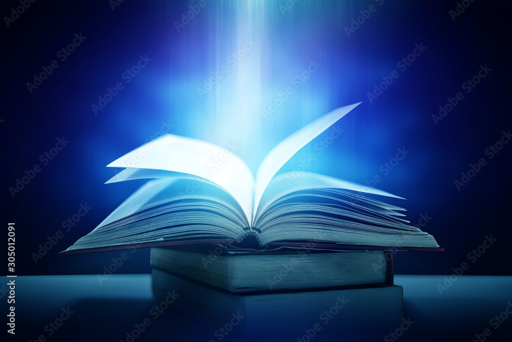 Poster imagine a picture book of an ancient book opened on a wooden table with a sparkling golden backgroun