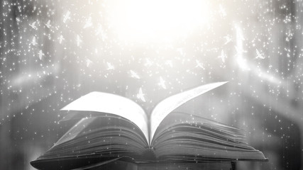  The blurred book that is bewitched with magic, the magic light in the dark, with the bright light...