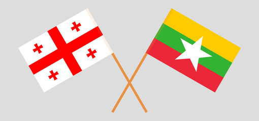 Crossed flags of Myanmar and Georgia