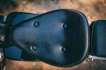 Motorcycle black leather seat in close up 