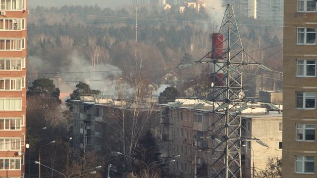 Small Russian town Troitsk. Houses, power lines and steam coming from the boiler room pipe