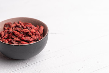 Goji berries isolated on white background. Healthy eating, copy space.