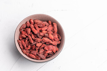Goji berries isolated on white background. Healthy eating, copy space.