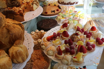 Fresh cake in showcase window sweet food