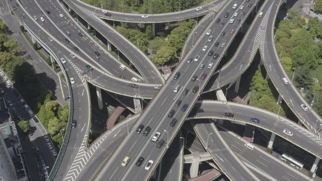 Aerial Video of car traffic and huge elevated road circle multilevel complex, car transportation scene in Shanghai, China in 4K UHD 