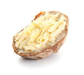 Piece of bread with butter isolated on white