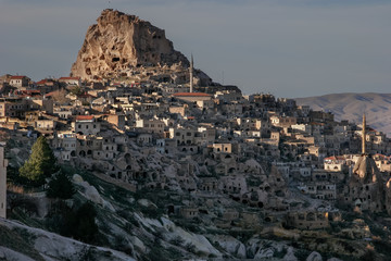 Fototapeta na wymiar The village of Uchisar. Last sunny rays. Cappadocia, Turkey.