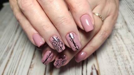 Trendy manicure design on a beautiful background.
