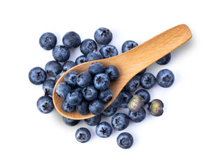 Blueberries  in wood spoon isolated on white background. top view