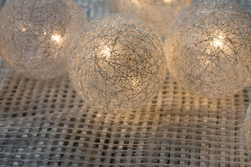 Christmas garland luminous balls of silver color.