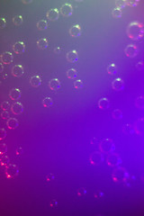 Macrophotography of air bubbles on the wall and bottom of a glass and pieces of ice in a soda...