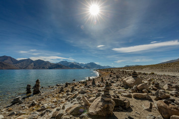 Fototapeta na wymiar Stone stacked on the bank of Pangong Lake or Pangong Tso in Ladakh, India 