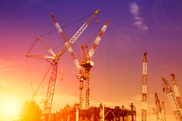 a lot of construction crane hoist at large construction site in Japan