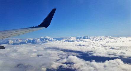 landscape above the clouds seen from the plane