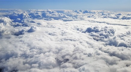 flying above a ceiling of clouds