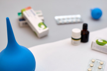medical still life. Pills, syringe, tube of medicine on a white background.