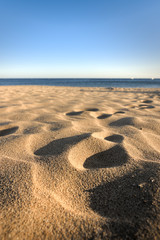 footprints in sand at beach