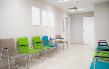 Esthetic and clean modern private clinic or vet waiting room with empty posters - obrazy, fototapety, plakaty